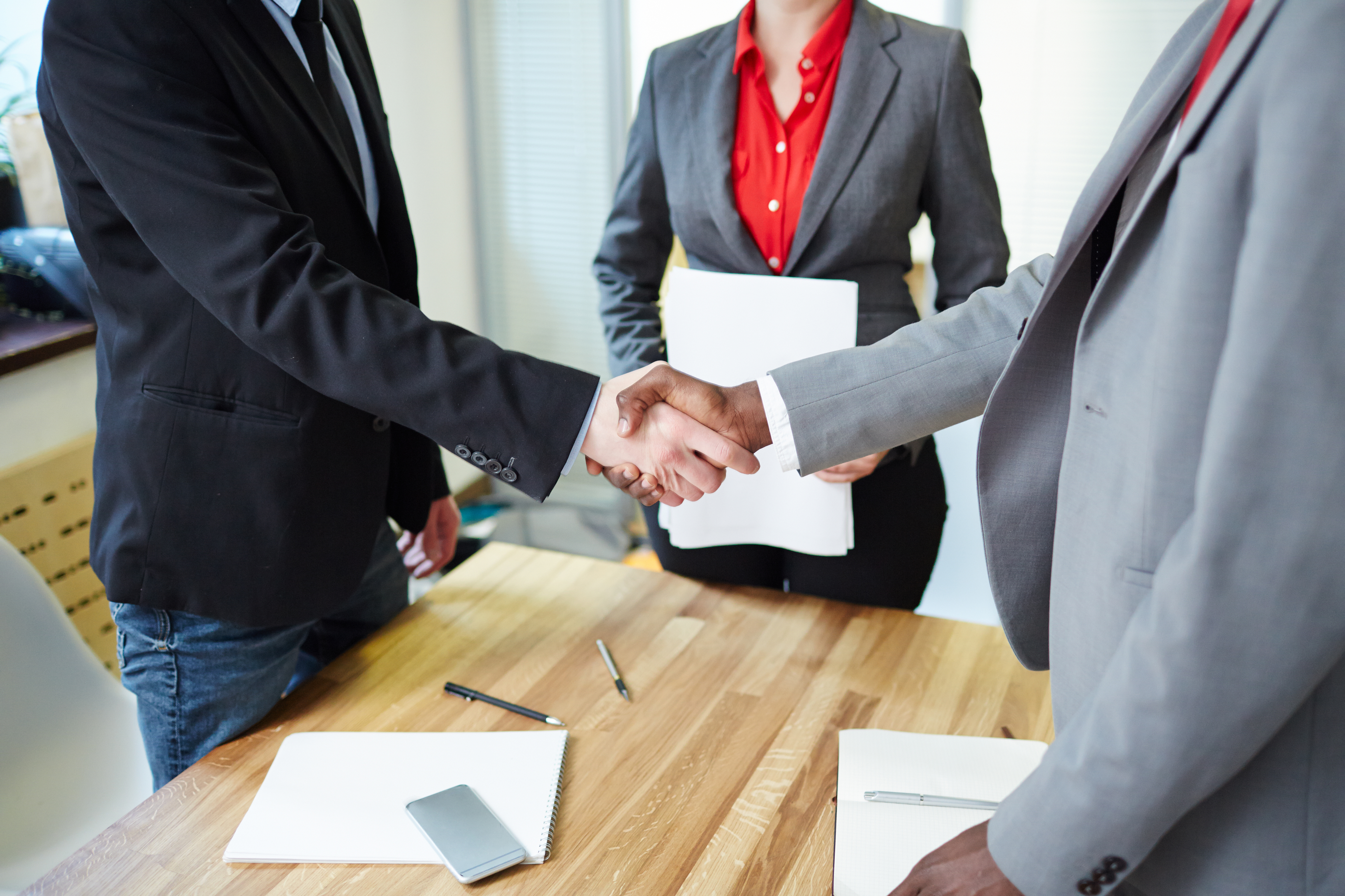 Business people shake hands