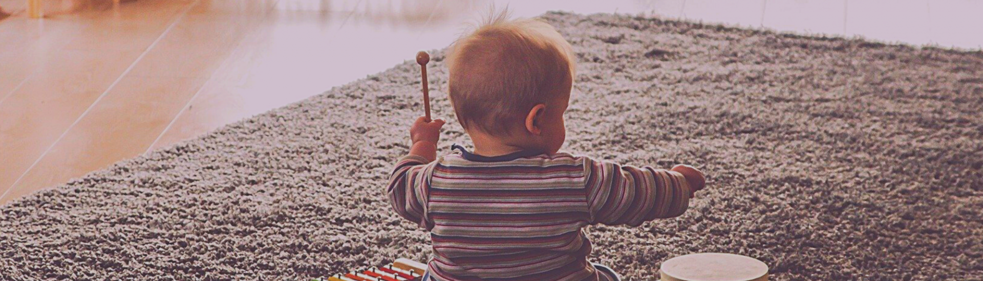 Baby playing with xylophone